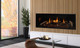 Nordik fireplace with glass firebox panels and birch logs