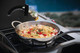 food in pot on side burner
