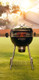 charcoal grill with cutout to see rotisserie
