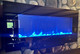 showroom electric fireplace with blue lighting