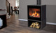 Cube gas stove on short pedestal with log underneath in a living room