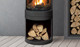 black S50 gas stove with wood pedestal