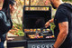people grilling food