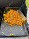 chorizo and eggs cooking on griddle