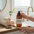 Warm, creamy, and deliciously spiced — our Spiced Chai Latte Castile Hand Soap is pure comfort in a bottle. Made with saponified organic olive and coconut oils, this gentle cleanser infuses your skin with the rich aromas of coffee, vanilla, and chai spices. Notes of clove, cardamom, nutmeg, ginger, and sweet orange create a cozy, aromatic experience that feels like a warm hug for your hands.