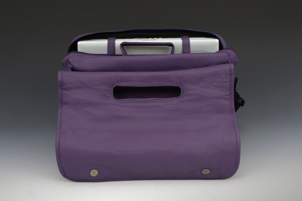 One section has zippered closure with wide opening also with computer straps for stability.
Second section is open with zippered wall pocket for easy access.