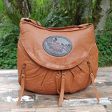 Cognac Medium Route #66 Hobo with Tooled Dogwood Medallion.  A little taller and wider than the small.  Roomy without looking too big.