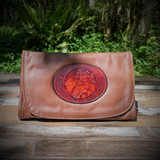 Combines the elegant look and quality of soft leather with a Tooled Leather Medallion on the front flap.