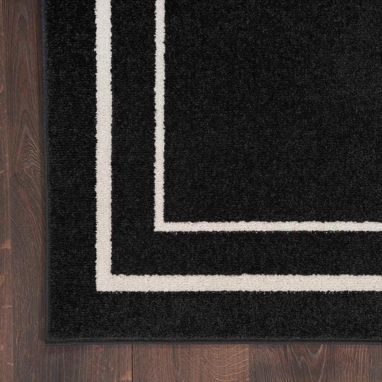 Nourison Essentials NRE02 Black Ivory Rug Corner