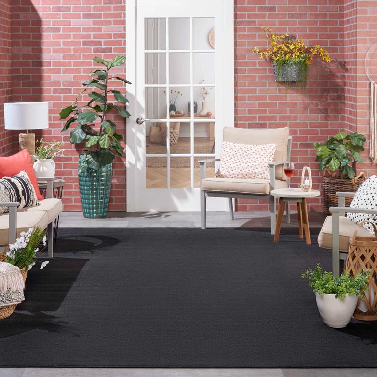 Nourison Essentials NRE01 Black Area Rug Outdoor Room Scene