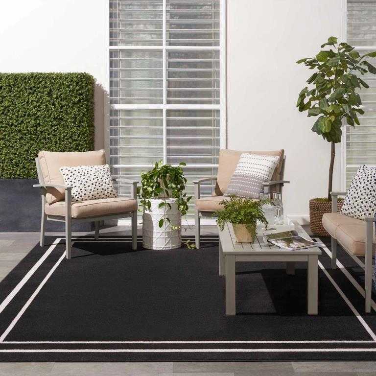 Nourison Essentials NRE02 Black Ivory Area Rug Outdoor Room Scene