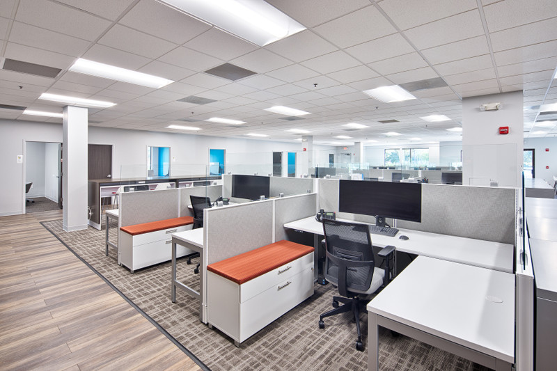 Real estate and home builder design center with selection displays and consultation seating in Orlando