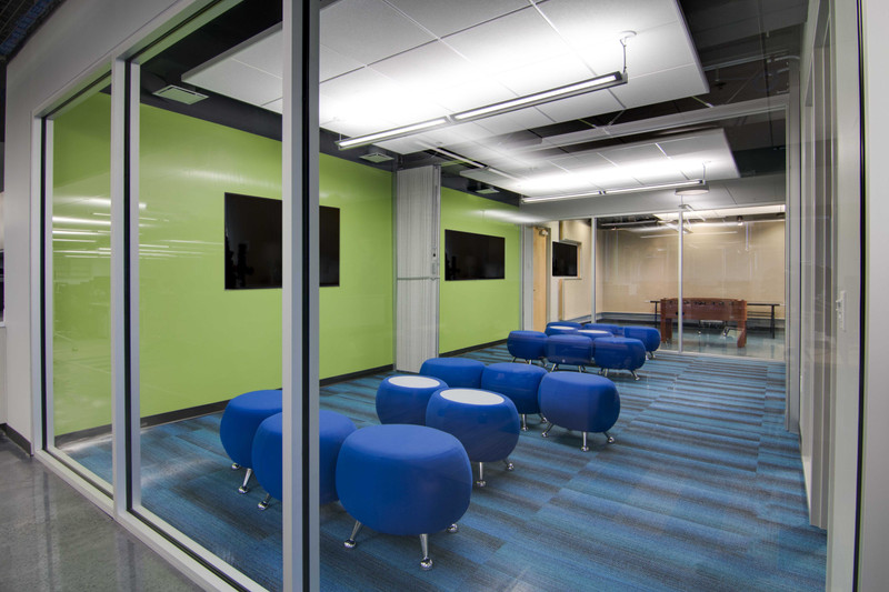 Technology company open-plan office with benching workstations and collaborative seating in Orlando