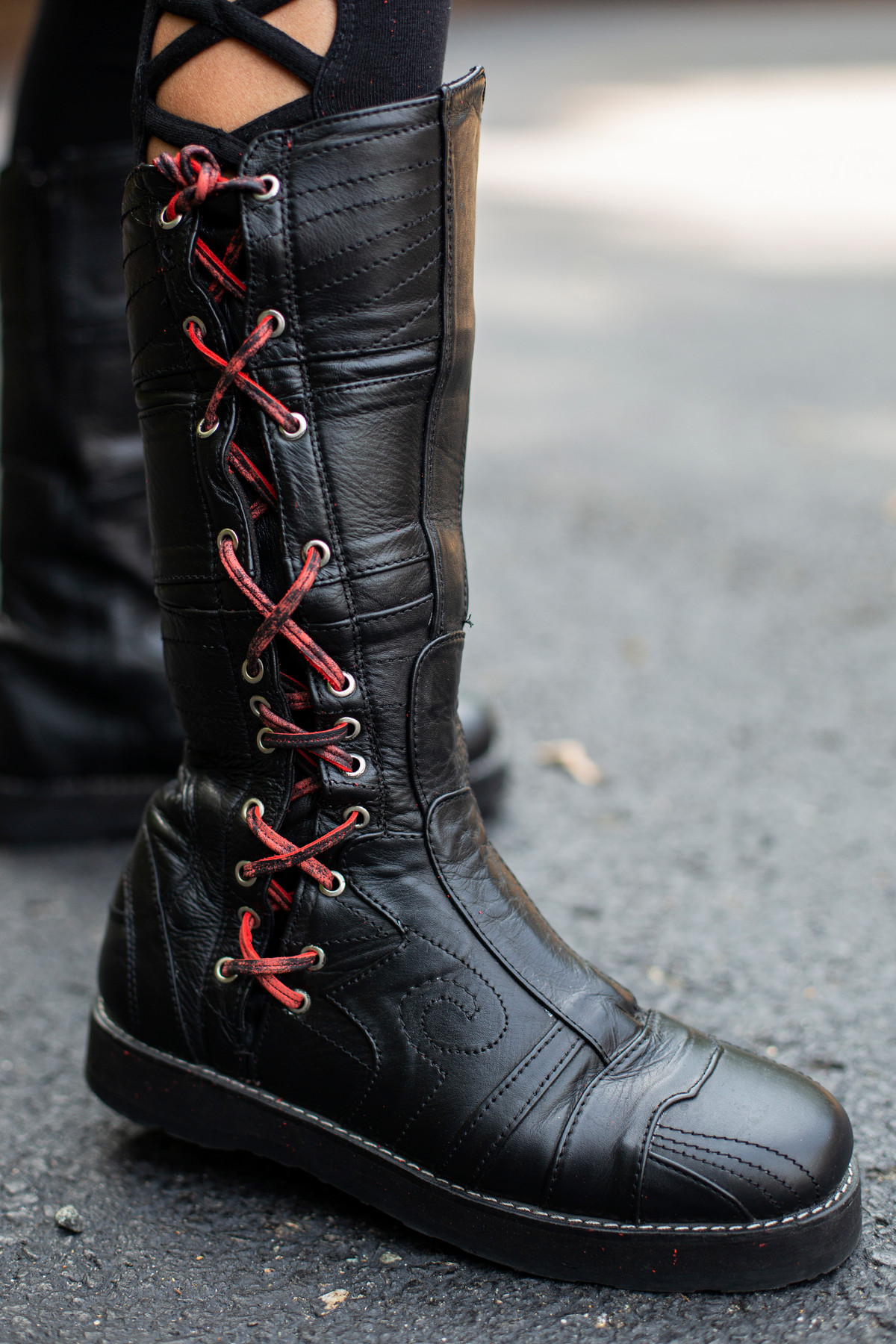 black boots with red shoe laces