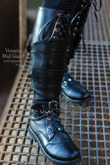 Versatta Greave over top Versatta Boots (paired with Versatta Mid Guard and Versatta Ankle Chain sold separately), front view