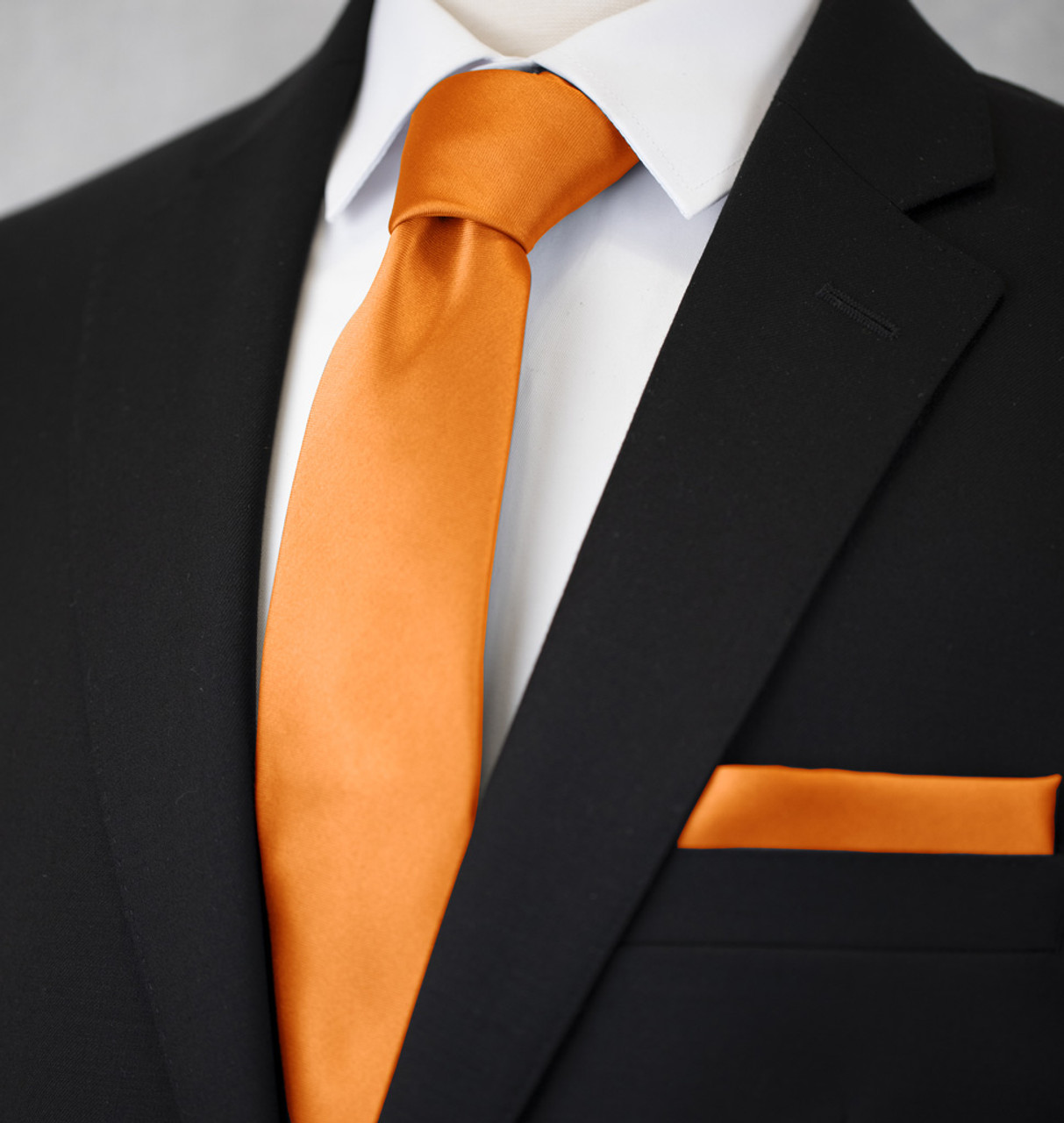 black suit orange tie