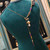 Collier Modulable "L'Oiseau de Paix" – Perles Noires, Améthyste & Grue en Origami