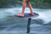 Close-up of rider’s stance on the Connelly Pilot foilboard with EVA traction pad visible