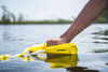 Yellow Proline Torq wakesurf handle floating on water with soft end caps Yellow Proline Torq wakesurf handle floating on water with soft end caps