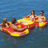 Four people relaxing on the Sportstuff Cantina inflatable island