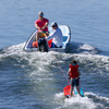Child on O'Brien Platform Trainer Waterski behind small boat