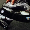 Howies black hockey skate guards showing moisture-absorbing terry cloth lining and interior blade protection strip