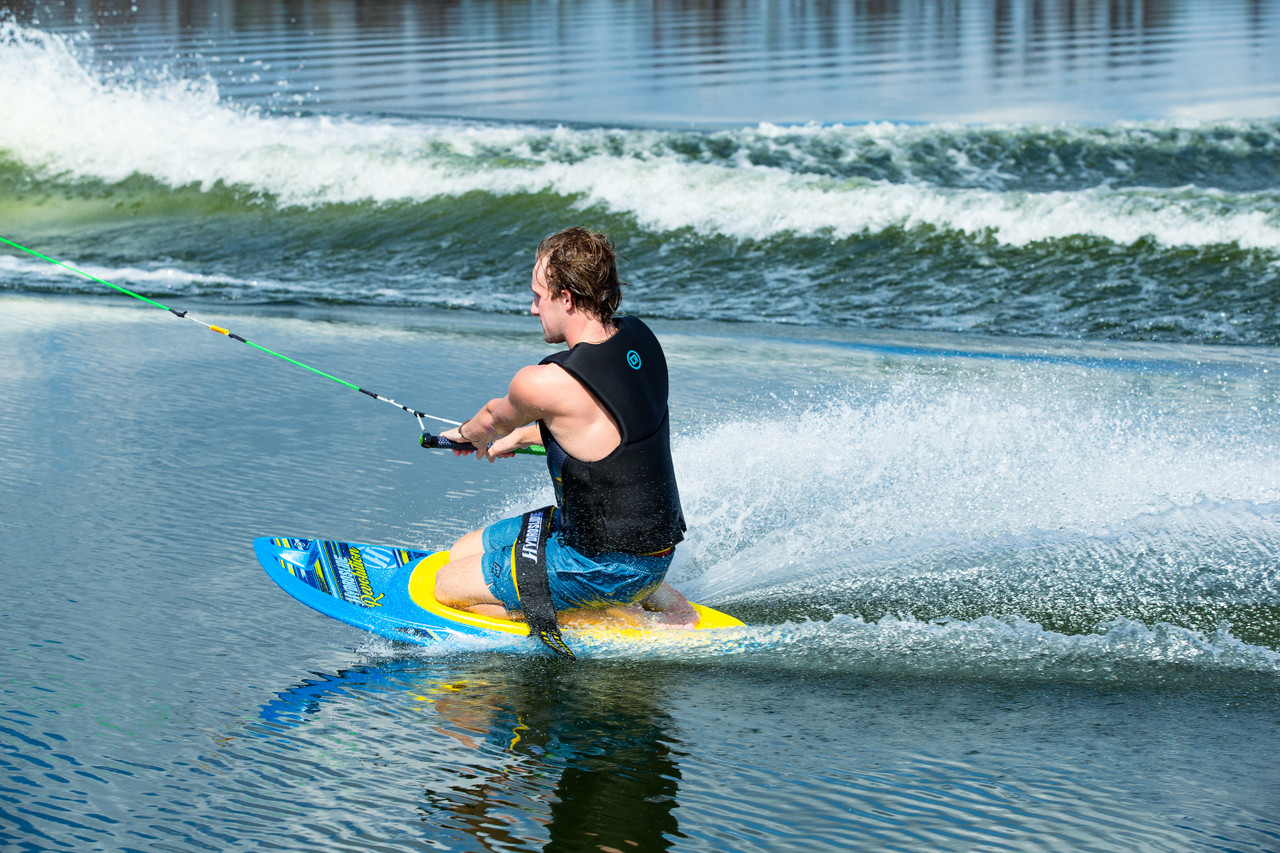 Hydroslide Revolution Kneeboard, kneeboard, spoon shape kneeboard, easy to learn kneeboard, HydroHook kneeboard, best kneeboard for beginners, high-performance kneeboard, kneeboard with knee wells, durable kneeboard, buoyant kneeboard, Hydroslide kneeboard, water sports equipment, kneeboarding tricks, EVA knee pad kneeboard, wakeboarding kneeboard, padded kneeboard strap, USA-made kneeboard, Midvale Utah boating, kneeboards for sale, kneeboarding for beginners