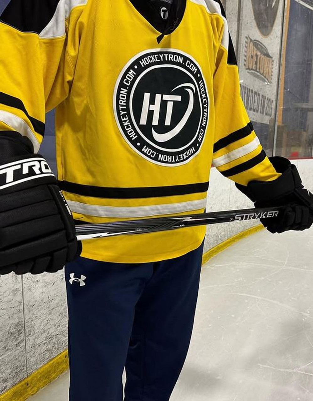 Player wearing TronX E1.0 Junior Hockey Gloves on the ice