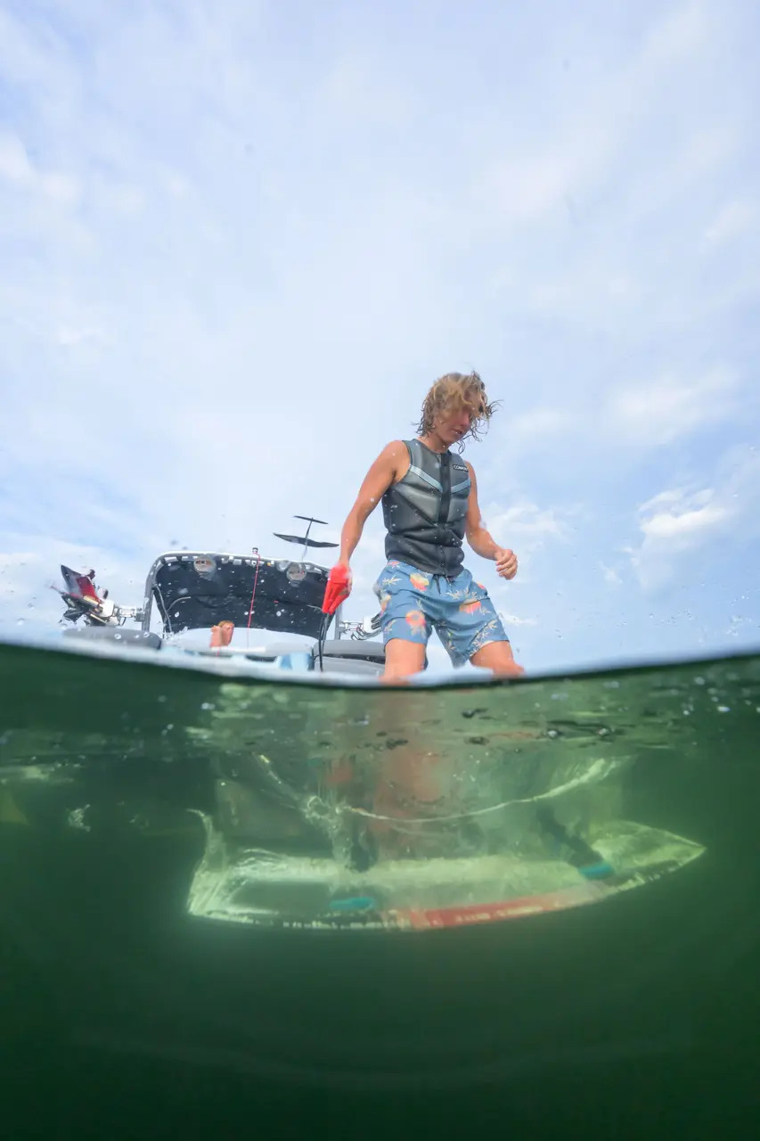 Rider behind boat on 2026 Connelly Reverb Wakeboard