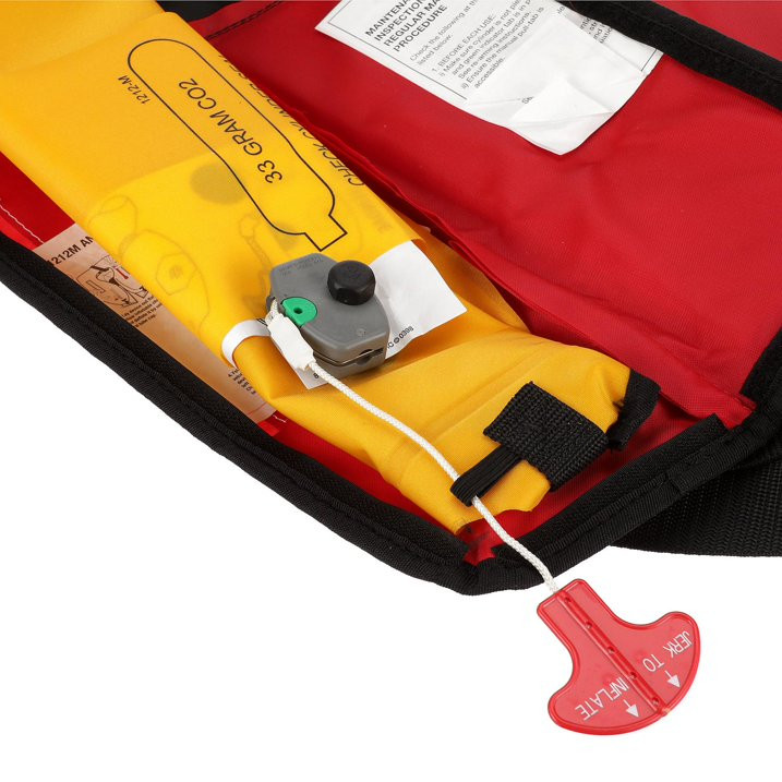 Close-up of Seachoice inflatable PFD manual activation pull cord and CO2 housing