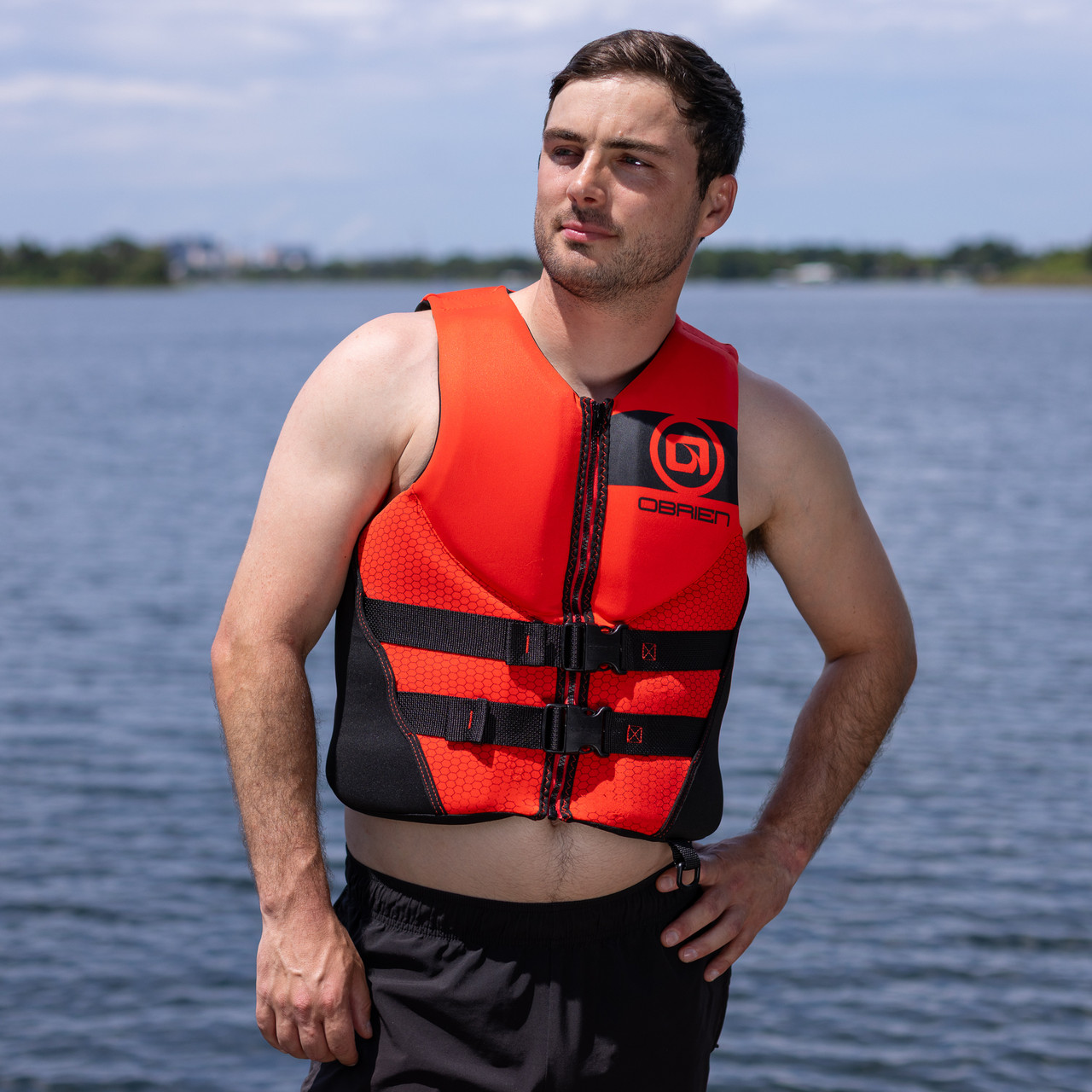 Wakeboarder wearing O'Brien Men's Traditional Life Jacket 2026 Red