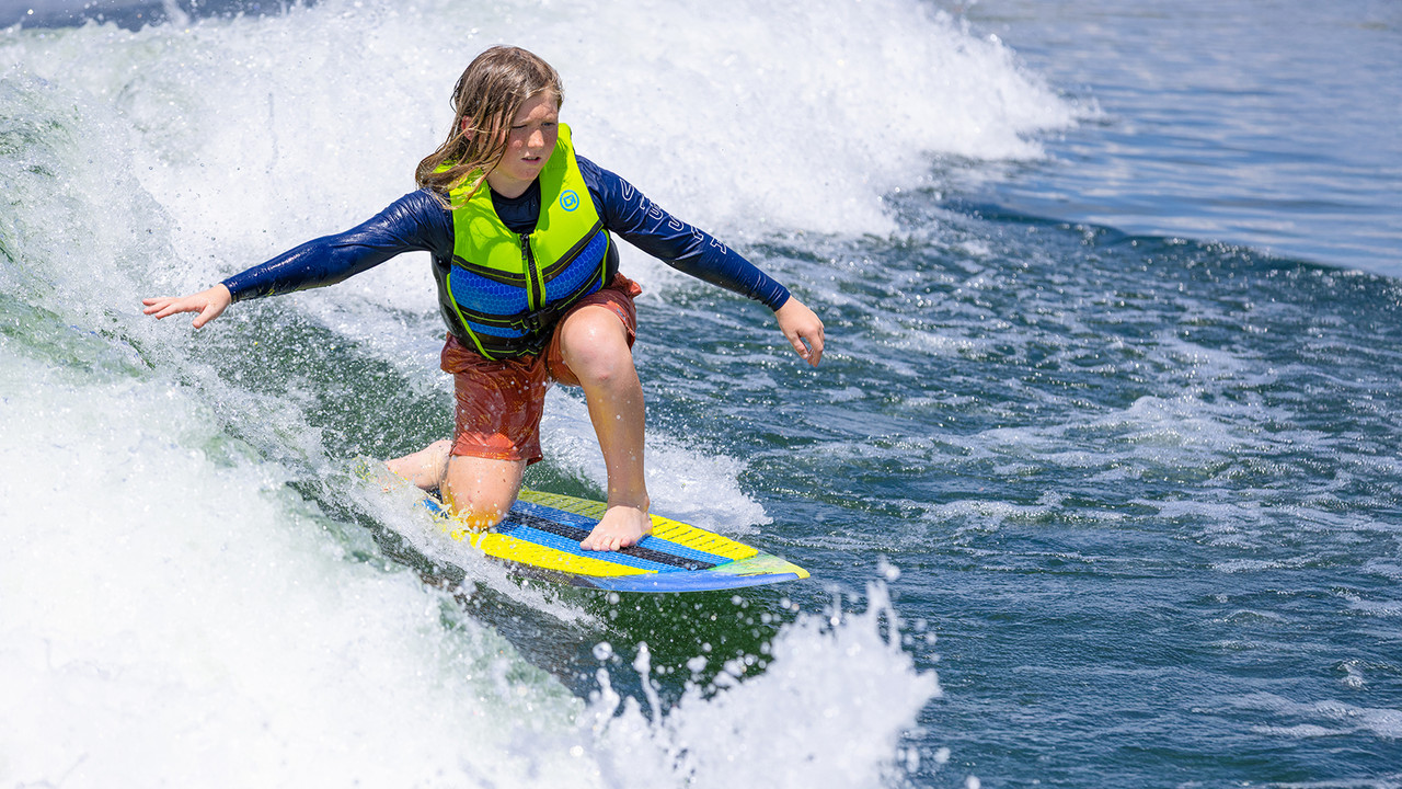O'Brien Micro Dust wakesurf board for beginner kids behind the boat