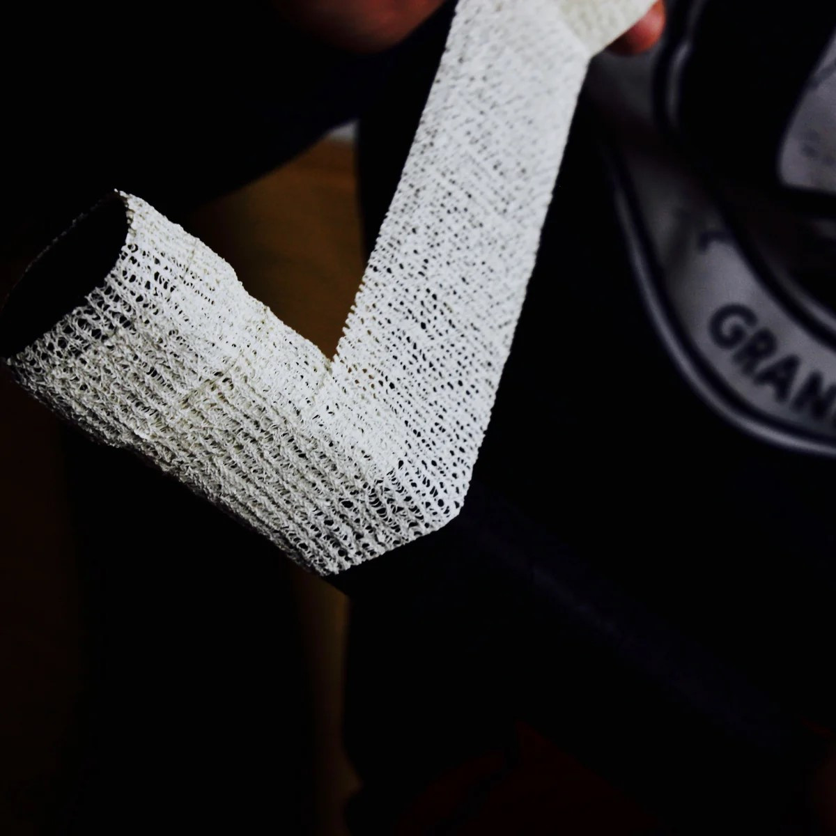 Close-up of Howies Stretch Grip Hockey Tape showing its stretchable mesh and soft abrasive texture