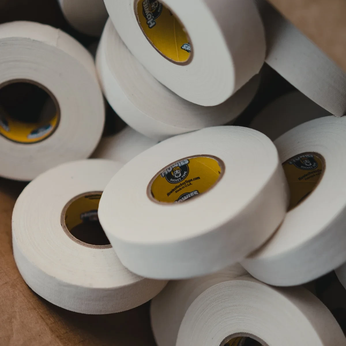 Close-up of Howies white cloth hockey tape showing its tightly woven 68-strand-per-inch construction