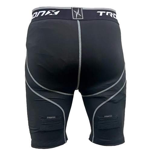Side view of youth hockey jock shorts showing Velcro sock tabs
