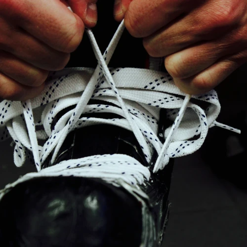 Howies white unwaxed cloth hockey skate laces with molded tips