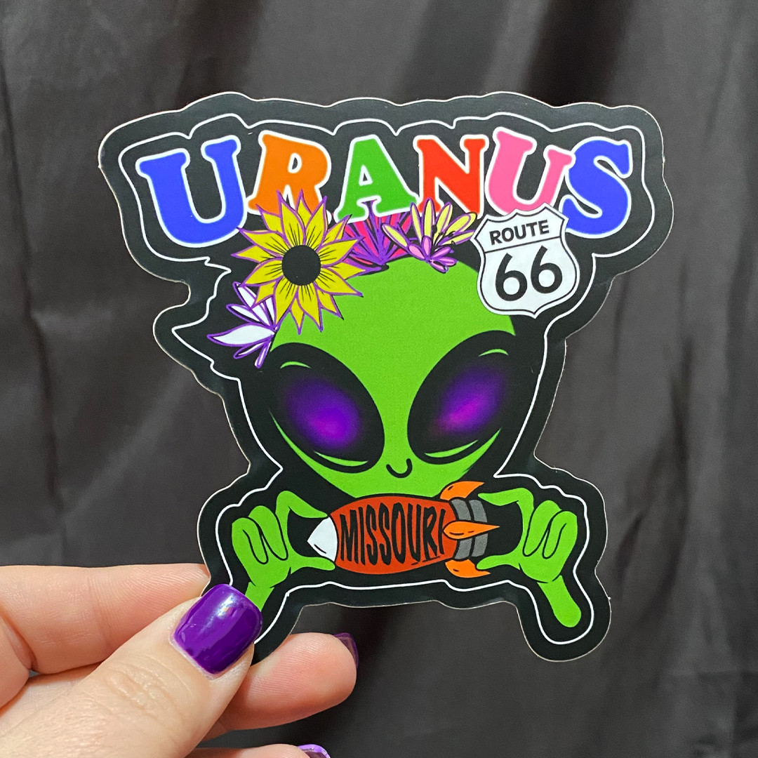 Uranus Missouri Alien Holding Rocket Sticker | Uranus Fudge Factory