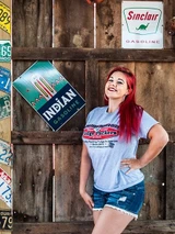 A person modeling the gray Uranus Fudge Packer Union t-shirt in a rustic barn setting.