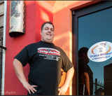 Customer wearing a black Fudge Packer Union t-shirt at the Uranus, Missouri storefront.