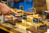 Fudge counter with hand choosing fudge included in The Mayor's Huge Package from Uranus Fudge Factory