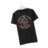 A black short-sleeve t-shirt displayed on a white hanger features a retro circular graphic with a rocket ship and text that reads "Uranus Fudge Factory: The Best Fudge Comes from Uranus," accompanied by "Uranus Missouri" and a Route 66 shield.