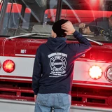 Back of navy Uranus Fire Dept hoodie with ‘When Uranus Is Hot, We Come Right Back’ print, red fire truck behind