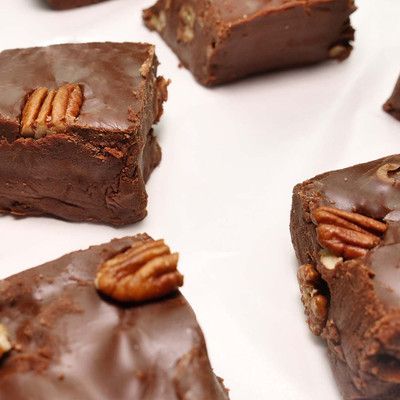 Chocolate pecan fudge squares topped with whole nuts from Uranus Fudge Factory.