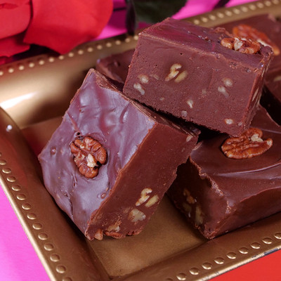 Chocolate Pecan Fudge from Uranus laying on a gold tray 