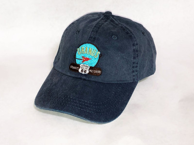 Faded navy baseball cap with an embroidered space rocket logo patch by Uranus Fudge Factory.