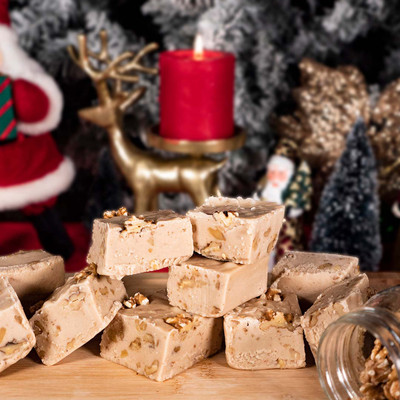 Reduced Sugar Maple fudge from Uranus on a cutting board with Christmas decor