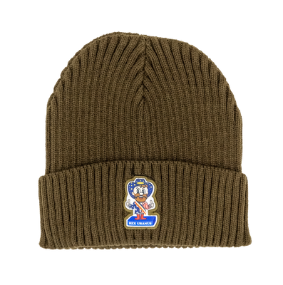 A solid olive green ribbed knit beanie displayed against a plain white background. Sewn onto the front of the folded cuff is a custom-shaped patch featuring a cartoon mascot. The mascot is a smiling man with a brown beard giving two thumbs up. He is wearing a starry blue cowboy hat, a matching starry blue shirt, a red and white striped sash, and red boots. He stands on a solid blue rectangular base that reads "REX URANUS" in white text.