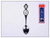 A silver Route 66 souvenir spoon featuring a black highway shield and gold cowboy boot on the handle next to its retail packaging
