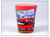 A red Route 66 souvenir shot glass featuring a classic red convertible car and a vintage neon motel sign