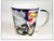A white ceramic souvenir mug featuring a motorcycle, a Route US 66 shield, a bald eagle, and an American flag design